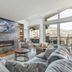 Antlers at Vail living room with fireplace, sectional seating, and mountain-view balcony