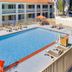 Motel 6 Thousand Oaks, CA outdoor pool with lounge chairs and motel balconies in Newbury Park