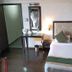 Hotel Dip Palace, Darjeeling guest room with double bed, desk, mirror and lamp