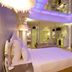 Wego Hotel - Linsen in Taipei City: mirrored bedroom with large bed, glass ceiling, and wall-mounted TV