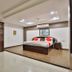 OYO 2494 Hotel Shree Plaza room in Bharuch with king bed and wardrobe