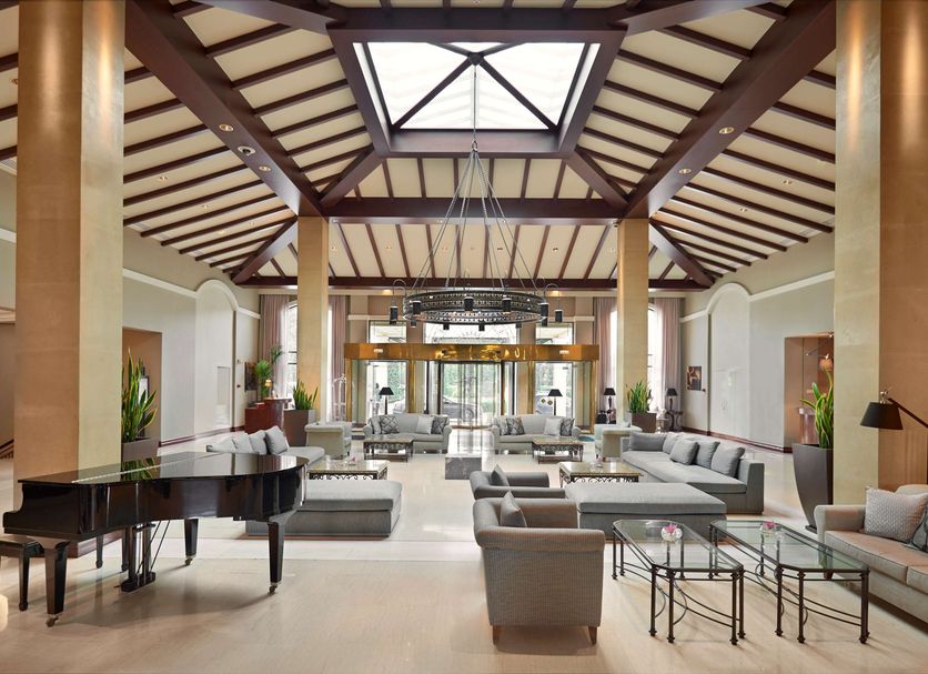 Hyatt Regency Thessaloniki lobby lounge with grand vaulted ceiling and grand piano in Thessaloniki