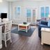 Royal Floridian Resort by Spinnaker in Ormond Beach living room with ocean-view shutters and seating area
