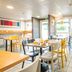 B&B HOTEL Nantes Parc Expos La Chapelle breakfast room with tables and chairs in La Chapelle-sur-Erdre