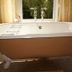 La Maison De Maitre in Arbrefontaine bathroom with freestanding soaking tub by a window