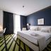 Workinn Hotel Gebze guest room with king bed, desk, wall-mounted TV, and floor-to-ceiling window