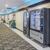 Capital O Duncanville Tx hallway with patterned carpet, vending machines and potted plants in Duncanville