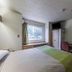 Motel 6 Charlotte University room with bed, desk, window, and TV in Charlotte