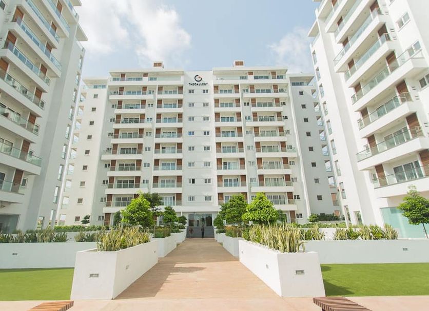 Accra Luxury Apartments at The Gallery in Accra, exterior of modern apartment hotel with landscaped walkway