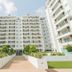 Accra Luxury Apartments at The Gallery in Accra, exterior of modern apartment hotel with landscaped walkway