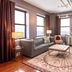 The Giacomo, an Ascend Collection Hotel in Niagara Falls suite with city views, sofa, chairs and wall-mounted TV