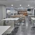 City Express by Marriott Lazaro Cardenas breakfast area with white tables and chairs and a serving counter