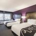 La Quinta Inn & Suites by Wyndham Virginia Beach guest room with two beds and large window