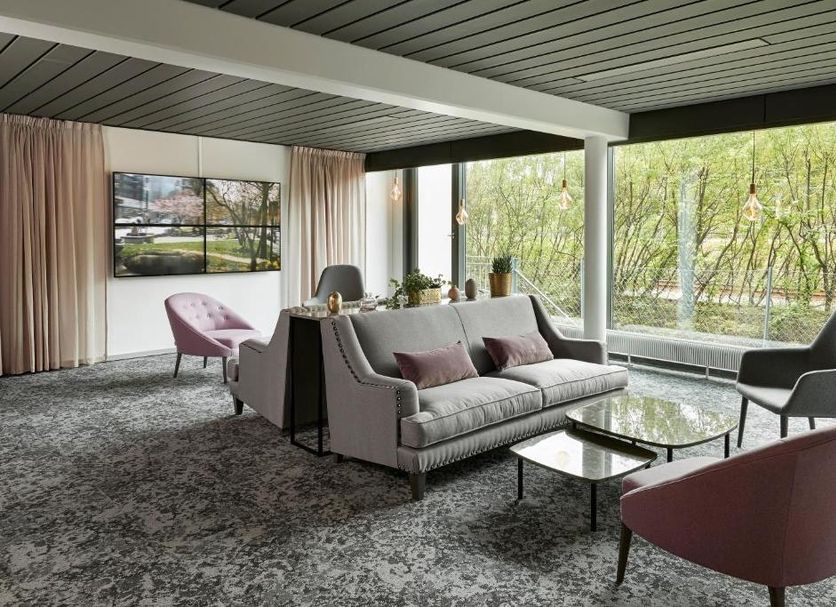 Go Hotel Østerport lounge with floor-to-ceiling windows and modern seating in Copenhagen
