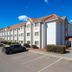 Motel 6 El Paso - Southeast exterior with parked cars and clear blue sky