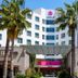 Akra V Hotel in Antalya exterior with palm trees and entrance canopy