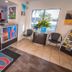 Motel 6 Ft Pierce lobby with check-in counter, seating, brochure rack and large window view