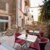 Outdoor courtyard seating at La Freixera in Solsona with stone walls and tables
