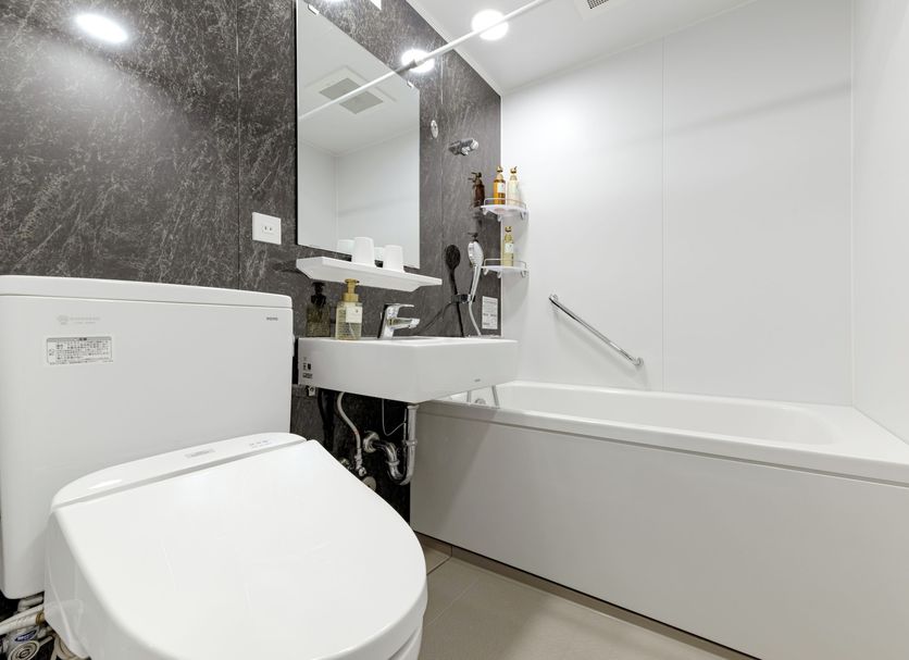 Ici Hotel Ueno Shin Okachimachi bathroom in Tokyo with bathtub, toilet and wall-mounted sink