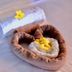 Blue Hill Victoria spa towel art with heart-shaped basket and yellow flowers on a bed