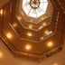 Hotel Shipra International, New Delhi: upward view of an octagonal atrium with skylight and warm lighting