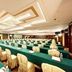 Sanshui Garden Hotel Foshan conference room with rows of long tables and banquet chairs