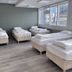 Hunavellir Guesthouse in Blonduos: shared guest room with four single beds and large windows