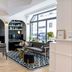 Hotel Louvre Montana Paris lounge with seating, patterned rug, bar shelf and large front window