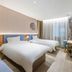 Home Inn Neo Shanghai North Bund room with two twin beds and large window in Shanghai