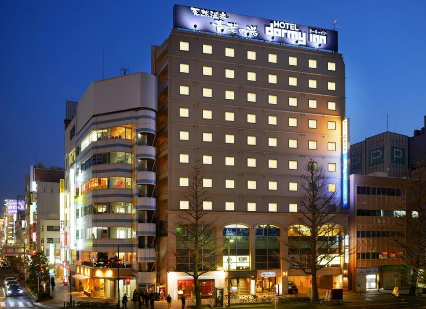 Dormy Inn Sendai Annex Natural Hot Spring exterior at night in Sendai, with lit windows and city street