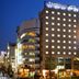 Dormy Inn Sendai Annex Natural Hot Spring exterior at night in Sendai, with lit windows and city street
