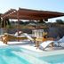 Kala Hotel Boutique in Maldonado: outdoor pool with lounge chairs and shaded pergola deck