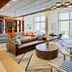 Four Points by Sheraton Raleigh Durham Airport lobby lounge in Morrisville with large windows and seating