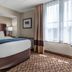 Comfort Inn & Suites Glen Mills - West Chester guest room with king bed and large window