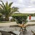 Les Vignes de la Chapelle, The Originals Relais in Sainte-Marie-de-Ré: terrace with palm trees and lagoon view