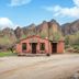 Saguaro Lake Ranch in Mesa with a small desert cabin and mountain backdrop