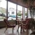 Evans Hotel in Heraklion lobby seating area with wicker chairs and large windows