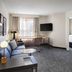 Residence Inn by Marriott Albany East Greenbush/Tech Valley suite with sofa, desk, TV and dining table