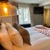 The Punch Bowl, Woodstock guest room with king bed, window view, wall TV and armchair