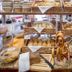 Tiptop Hotel Burgschmiet Garni, Nuremberg: bakery breakfast buffet with baskets of bread and pastries
