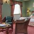 Best Western Sysonby Knoll Hotel in Melton Mowbray guest room with bed, wicker chairs and tea table
