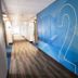 Holiday Inn Express & Suites Dayton-Huber Heights lobby hallway with blue geometric wall art and room number 2