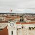Stay Hotel Coimbra Centro in Coimbra with a clock tower overlooking the city skyline and plaza