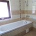 Flora Daisy Apartment in Borovets bathroom with bathtub, shower and toilet