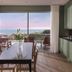 Sovn Experience+Lifestyle Cape Town dining area with floor-to-ceiling window and ocean view