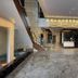 Hotel Grand Marian lobby in Ludhiāna with marble floors, modern chandelier and reception desk