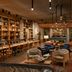 The Junto in Columbus lounge with bookshelves, seating area, and a large fireplace
