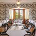Spicers Clovelly Estate in Montville dining room with set tables, patterned walls, and garden-view windows
