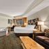 Best Western Northwoods Lodge in Siren: guest room with king bed, jetted tub, desk, TV and sofa