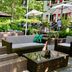 Fletcher Hotel Restaurant Boschoord Oisterwijk outdoor patio with wicker seating and umbrellas